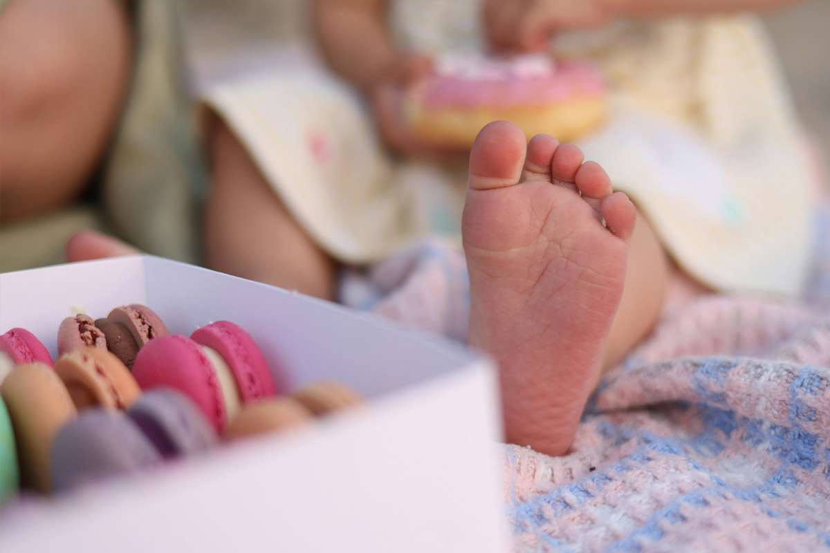 A child patient's foot is being examined.